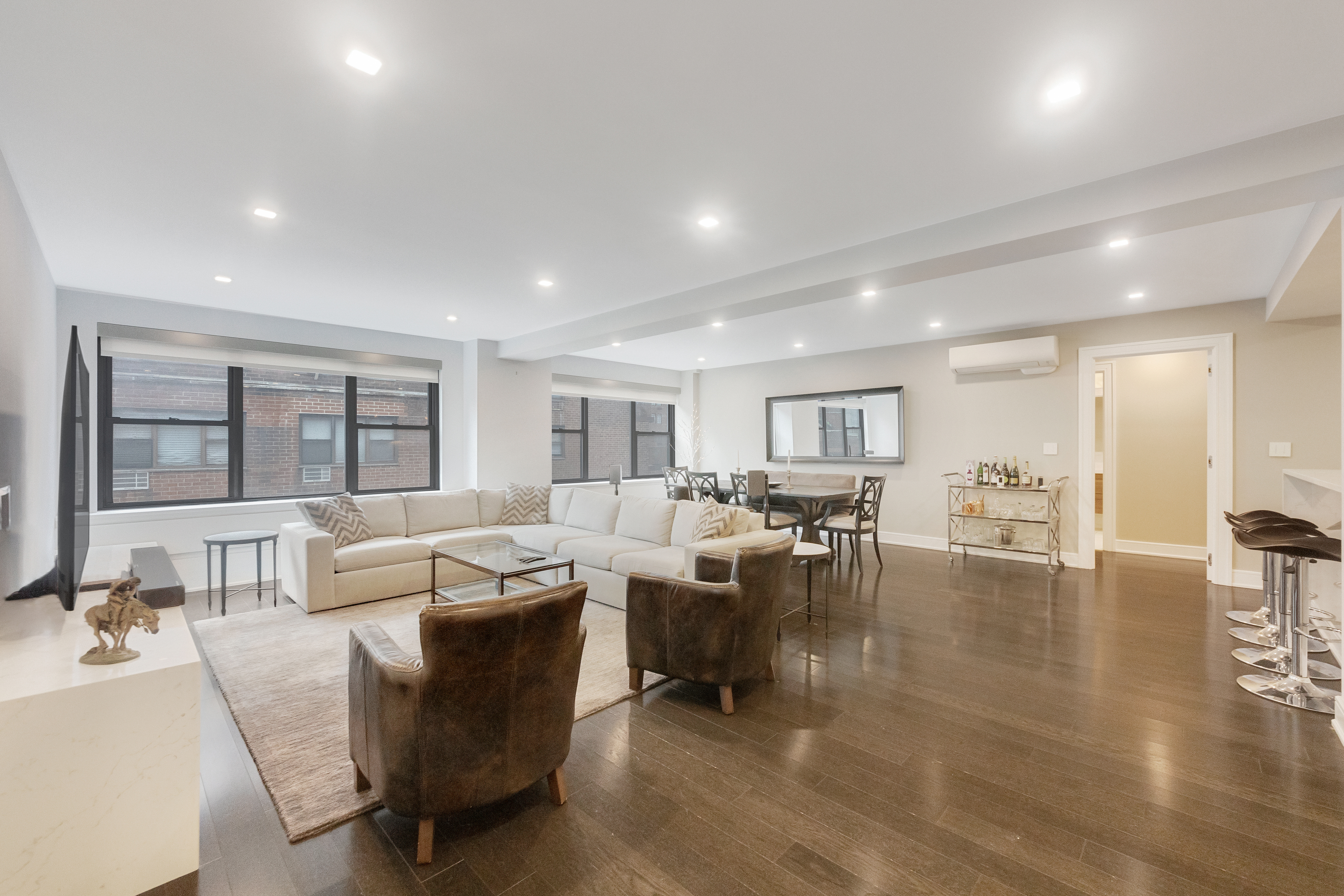 2 Tudor City Place, Unit 12DS Manhattan, NY 10017 - Photo 2 of 20 a living room with furniture and a table