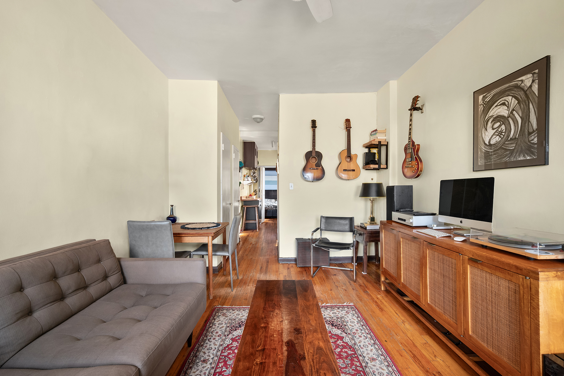 88 Charles Street, Unit 5D Manhattan, NY 10014 - Photo 6 of 11 a living room with furniture and a flat screen tv