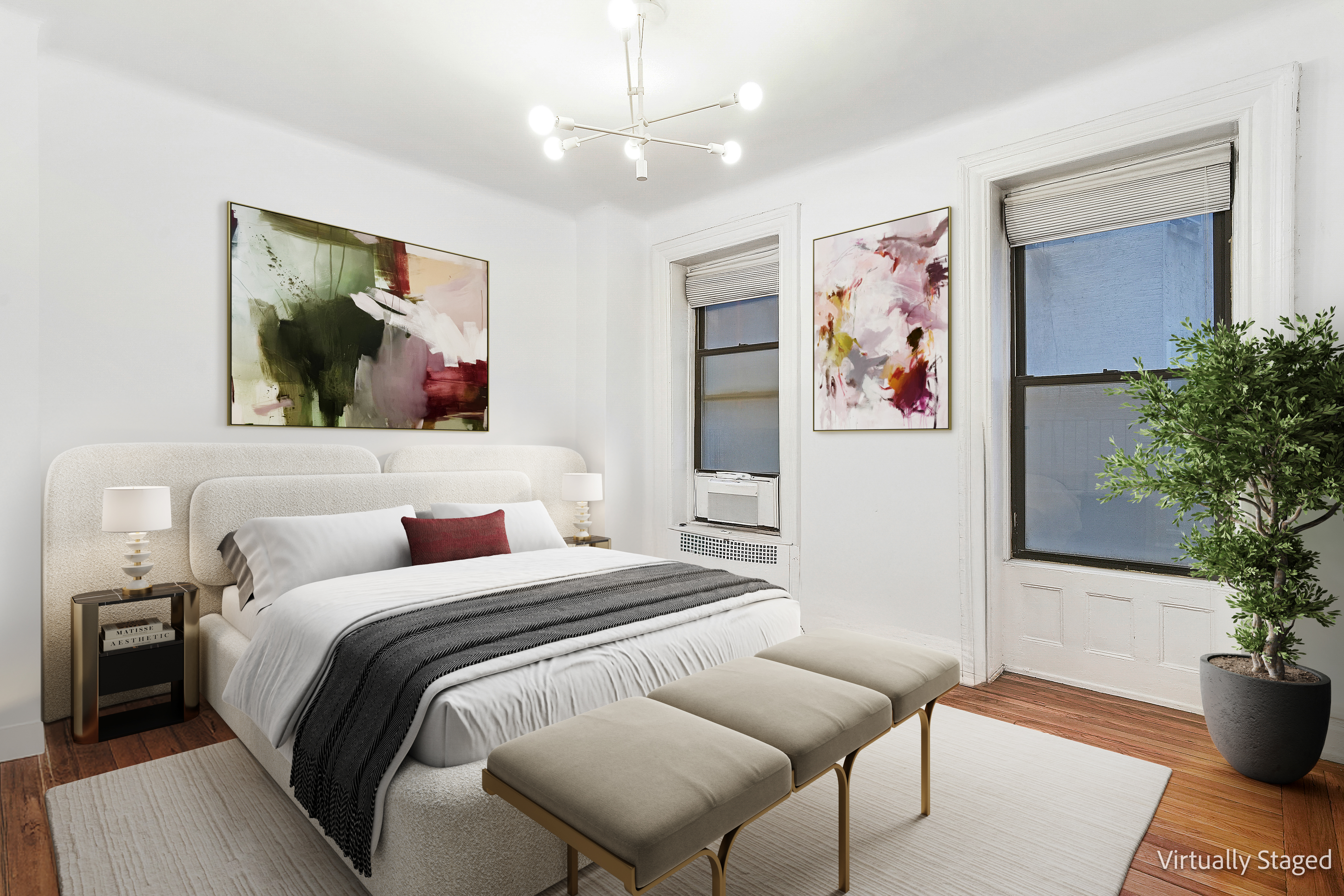 205 West 54th Street, Unit 3A Manhattan, NY 10019 - Photo 5 of 14 a bedroom with a large bed and a potted plant