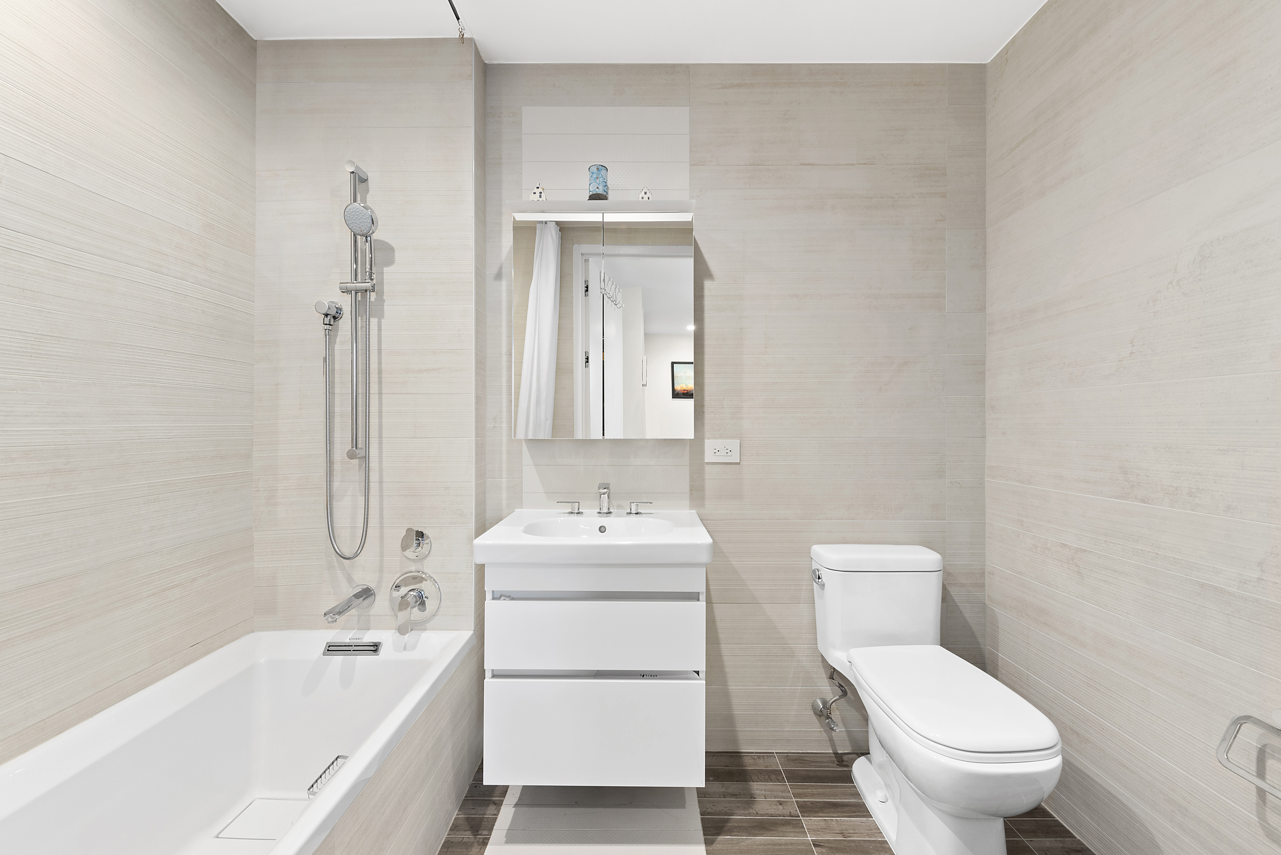 285 West 110th Street, Unit 9B Manhattan, NY 10026 - Photo 11 of 20 a bathroom with a toilet sink and mirror