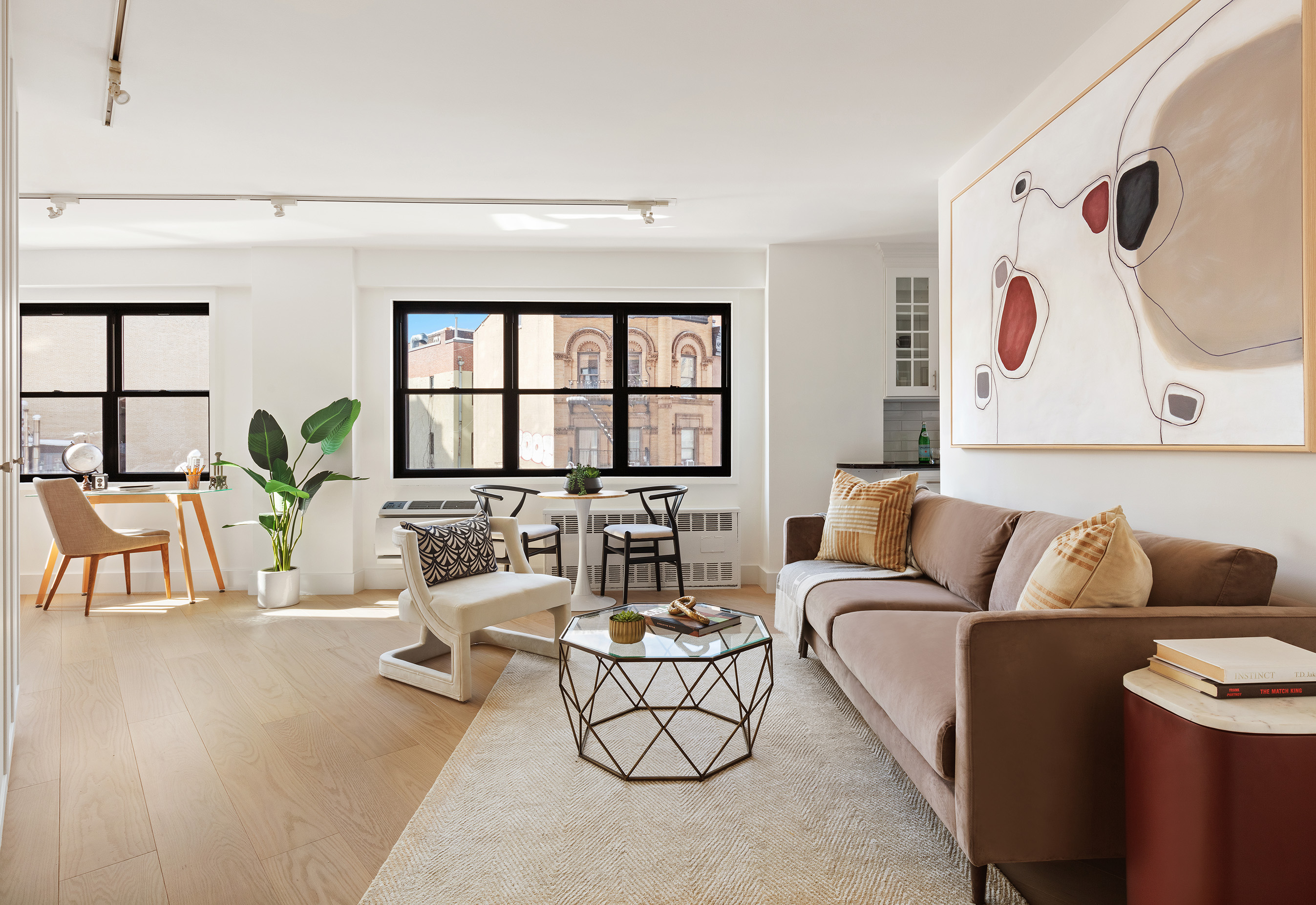 31 Jane Street, Unit 5A Manhattan, NY 10014 - Photo 12 of 13 a living room with furniture and wooden floor