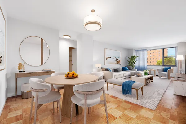 a living room with furniture a mirror a lamp and a large window