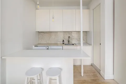 a kitchen with a sink and cabinets