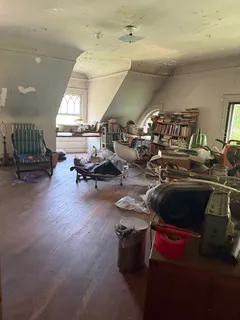 a room with gym equipment and a potted plant