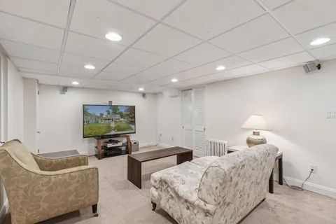 a bedroom with furniture and a flat screen tv