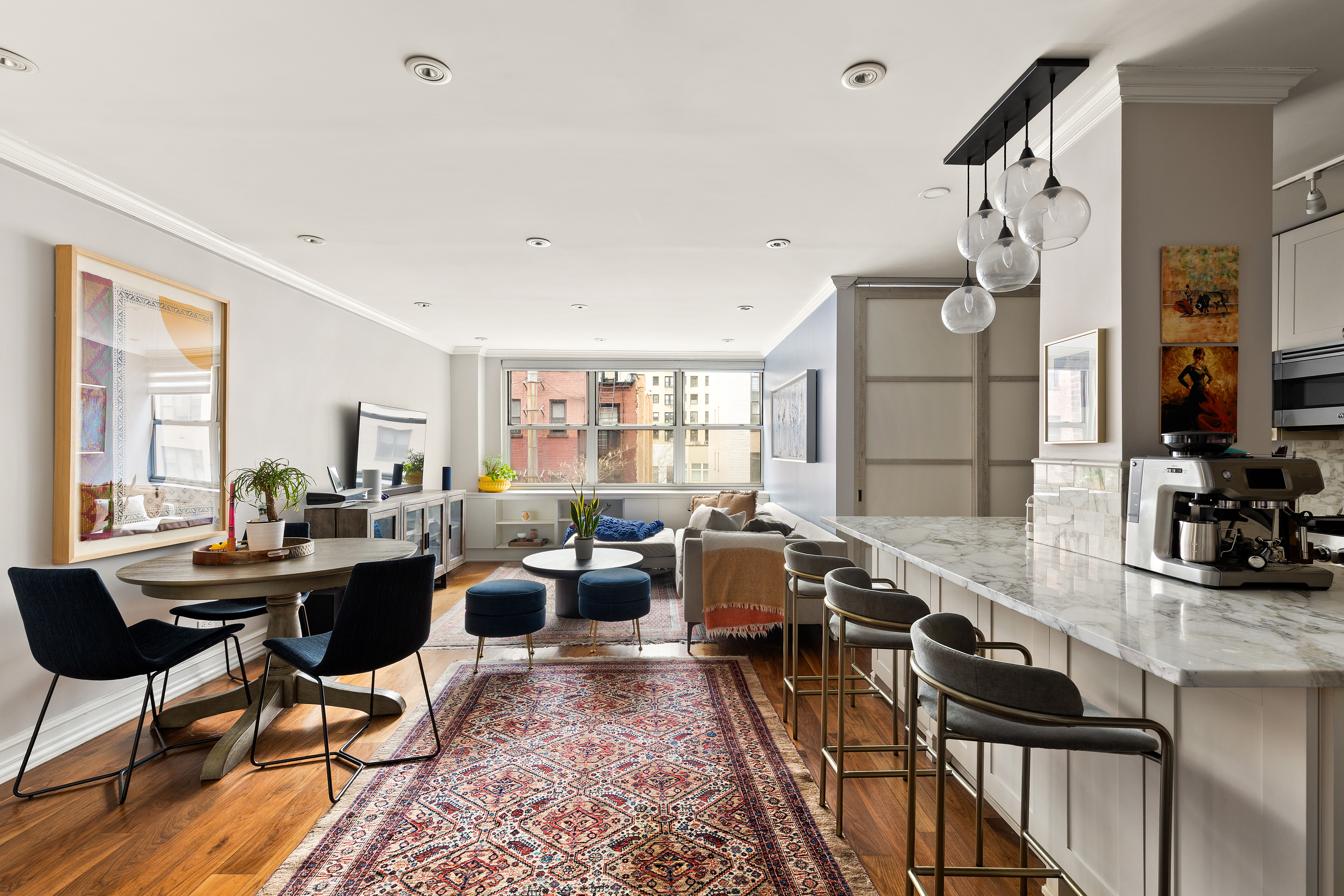 310 East 70th Street, Unit 6A Manhattan, NY 10021 - Photo 1 of 9 a living room with furniture large window and wooden floor