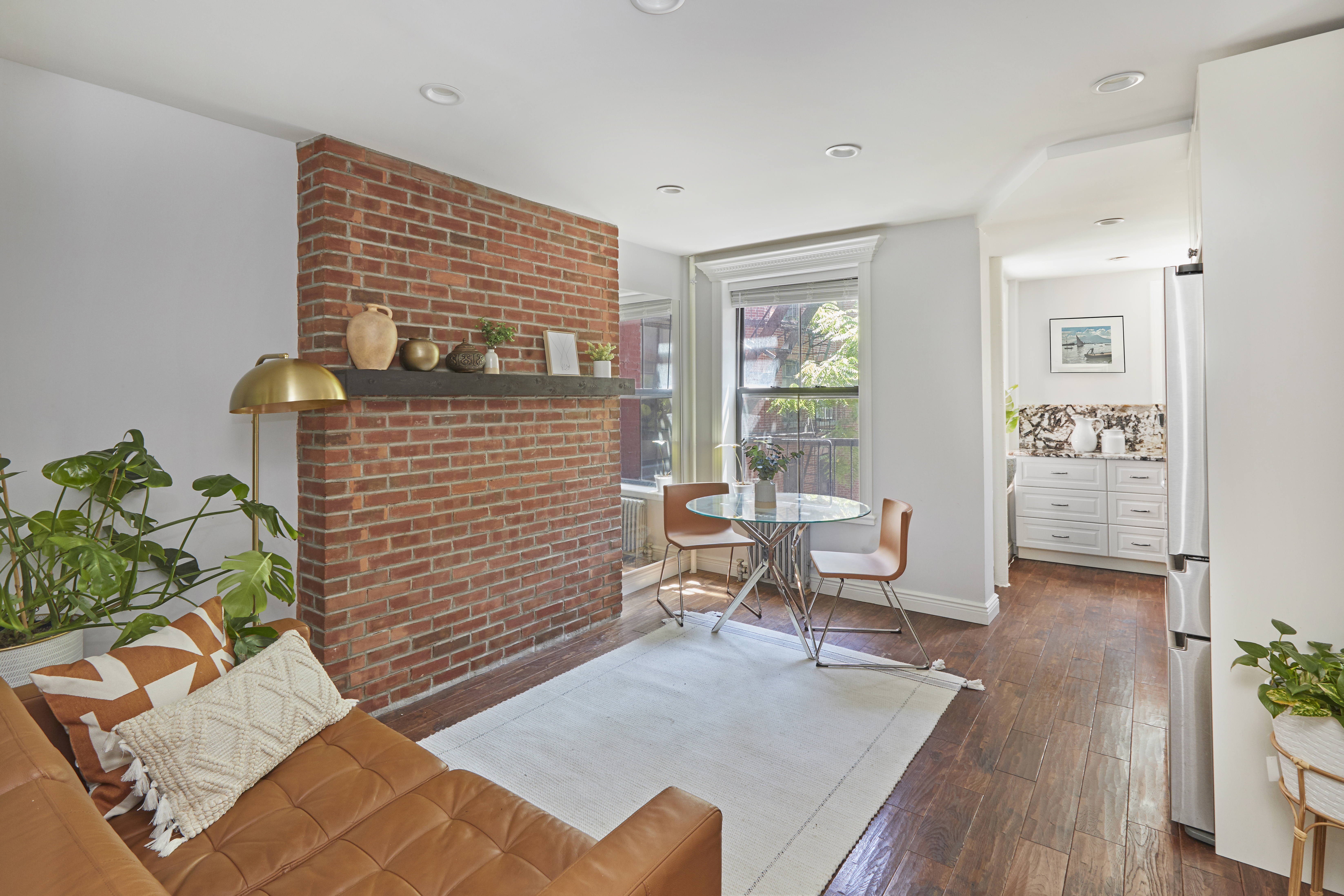 443 Hicks Street, Unit 3E Brooklyn, NY 11201 - Photo 1 of 7 a living room with furniture and wooden floor