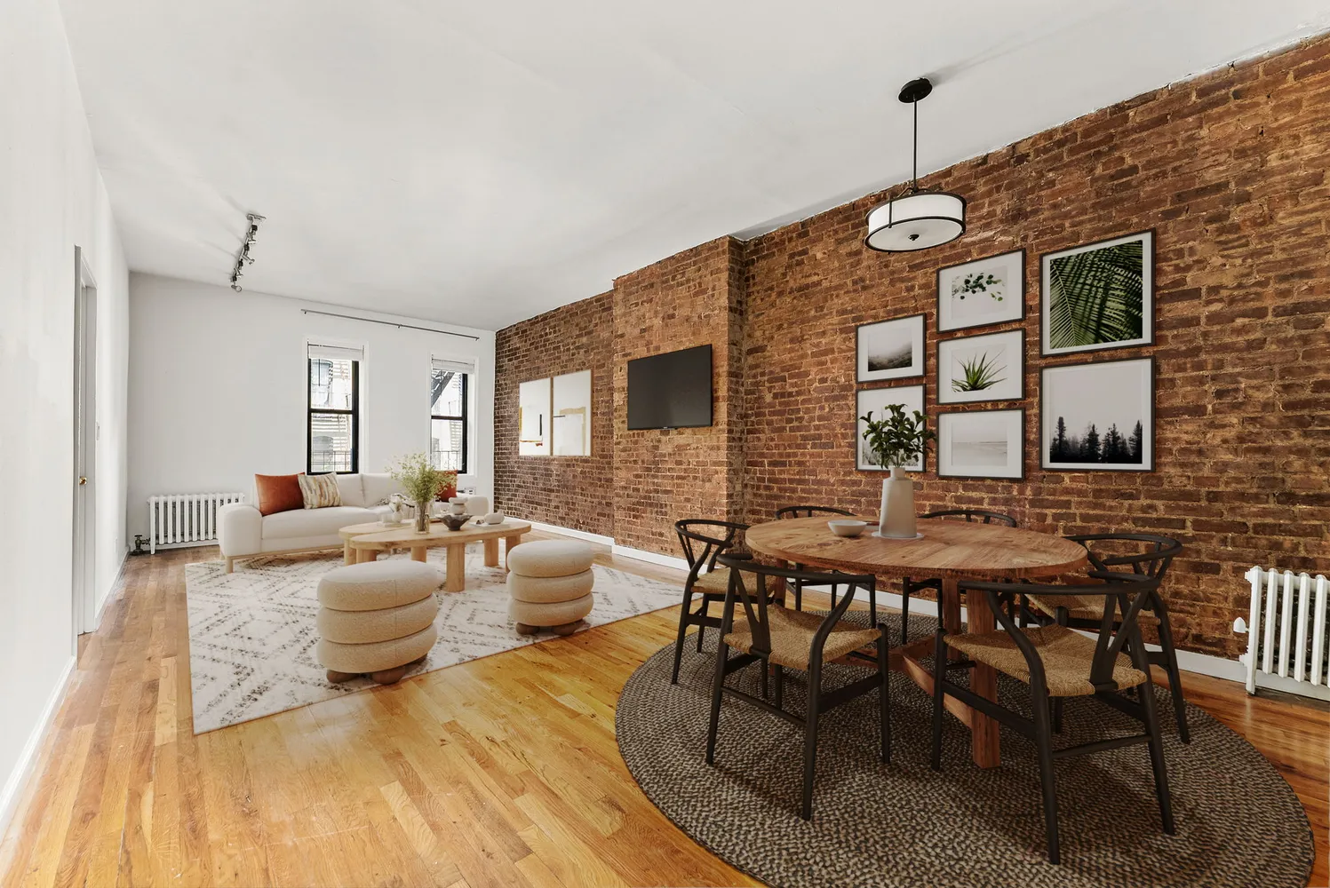 a living room with furniture and wooden floor