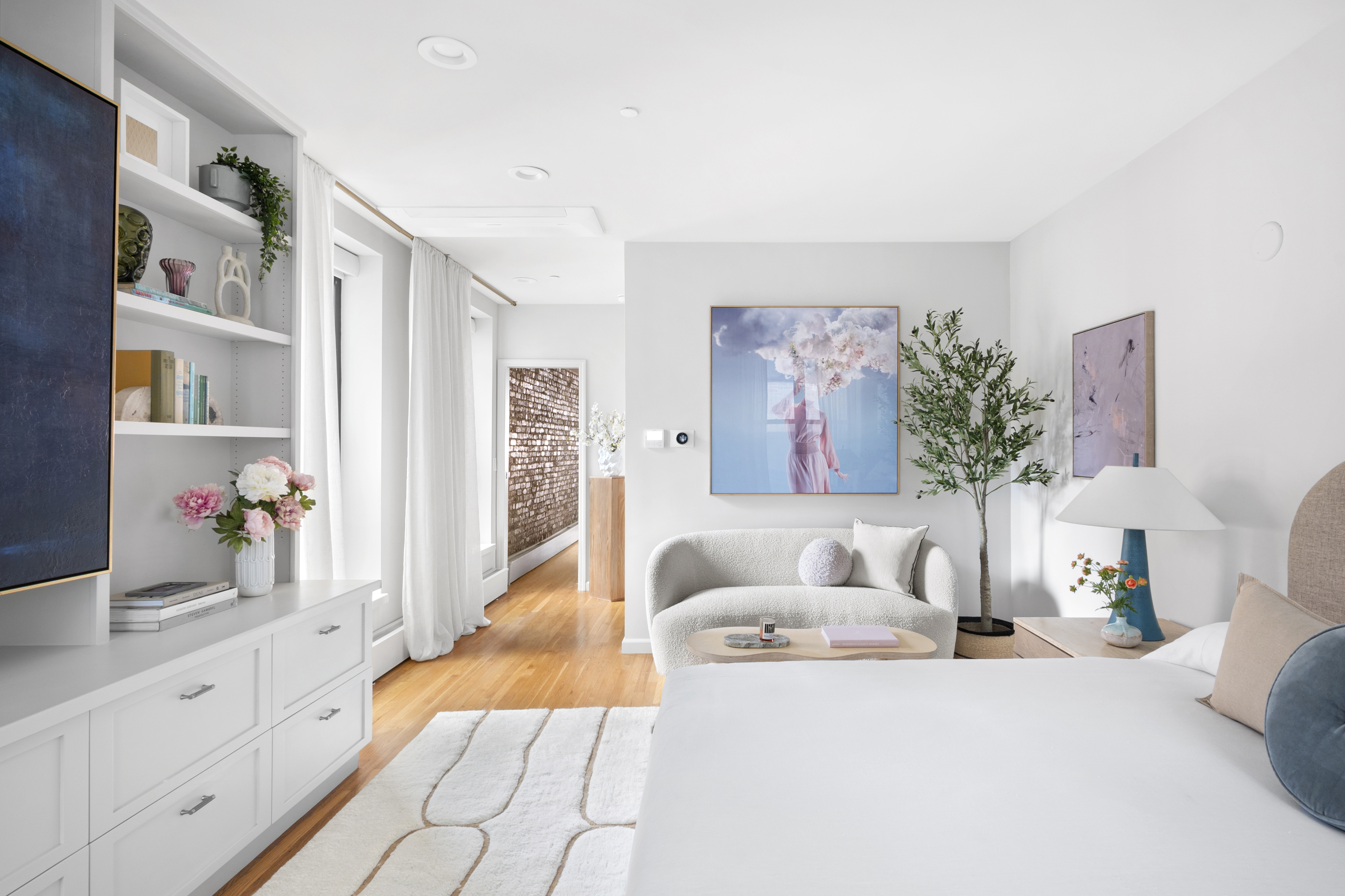 120 West 20th Street, Unit PH Manhattan, NY 10011 - Photo 8 of 15 a living room with furniture and flowers