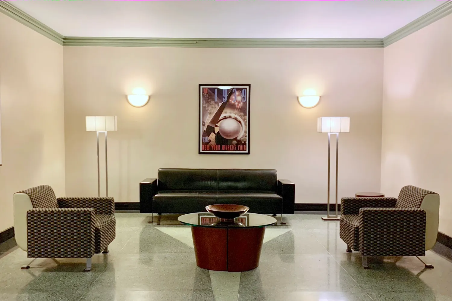 a living room with furniture and a lamp