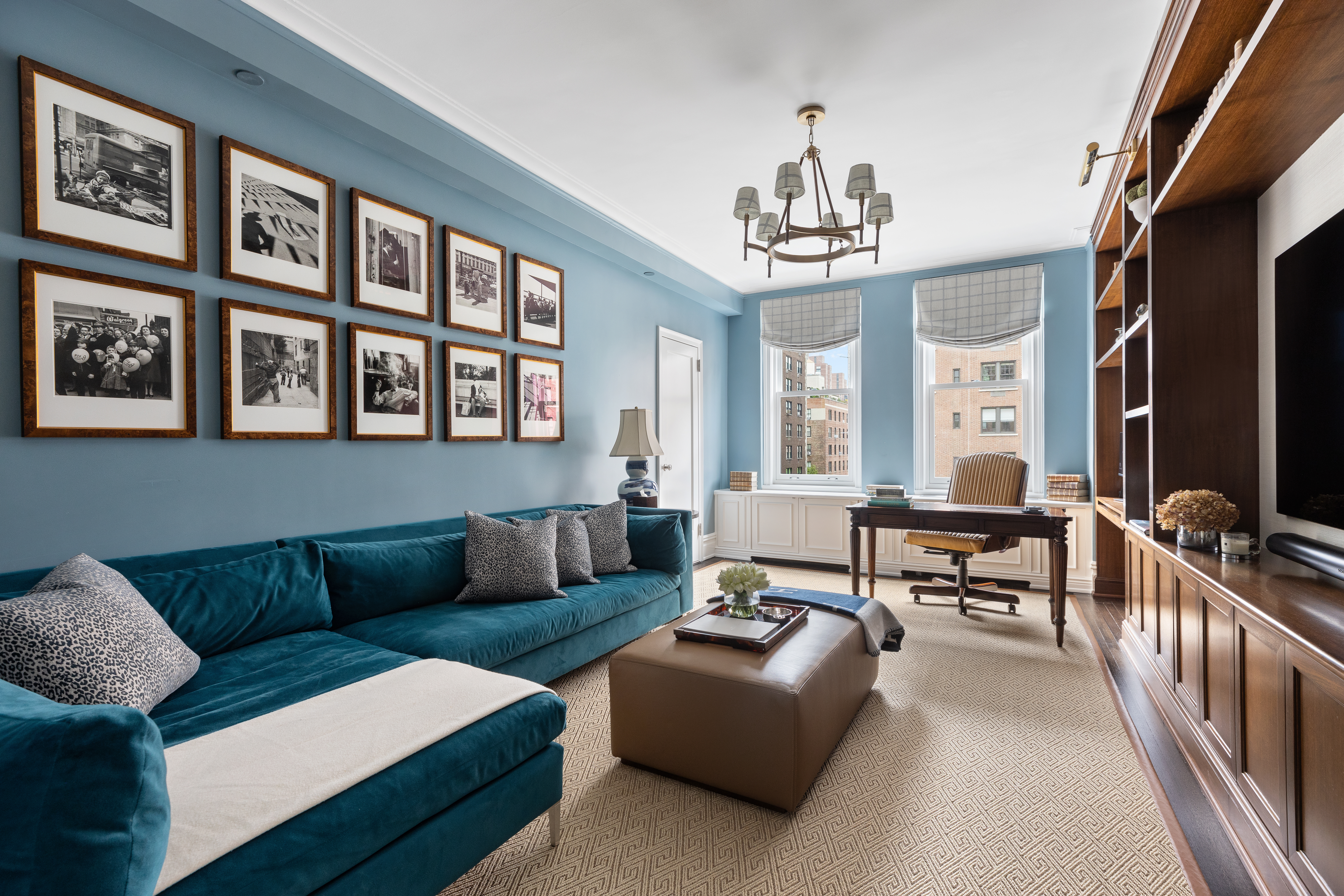 1112 Park Avenue, Unit 6A Manhattan, NY 10128 - Photo 7 of 15 a living room with furniture and a chandelier