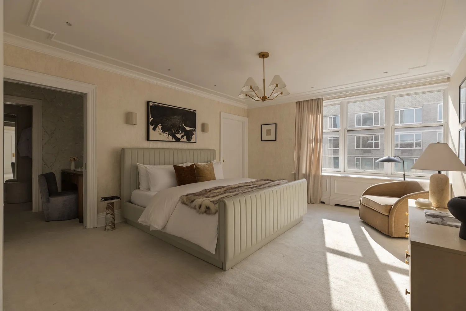 a bed room with furniture and a window