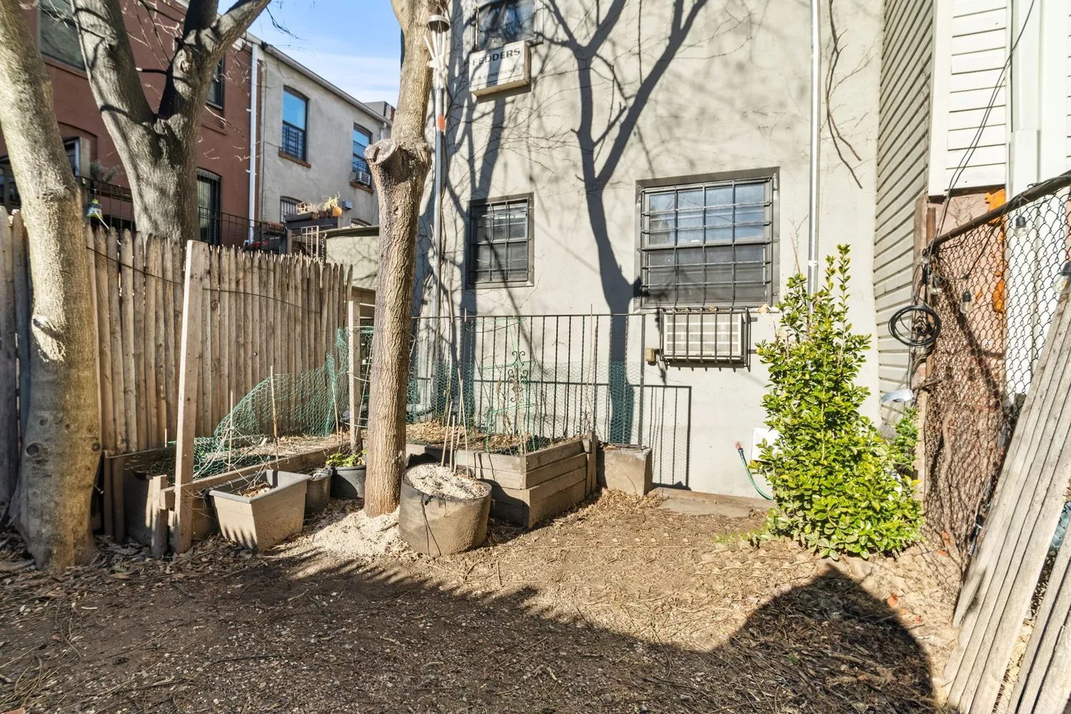 a view of a house with a large tree and a yard