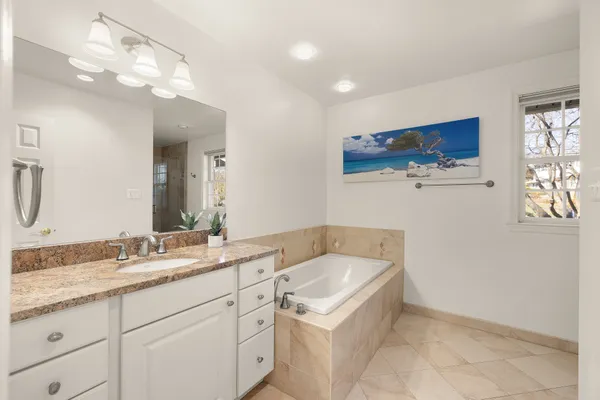 a bedroom with a bed and a table in it