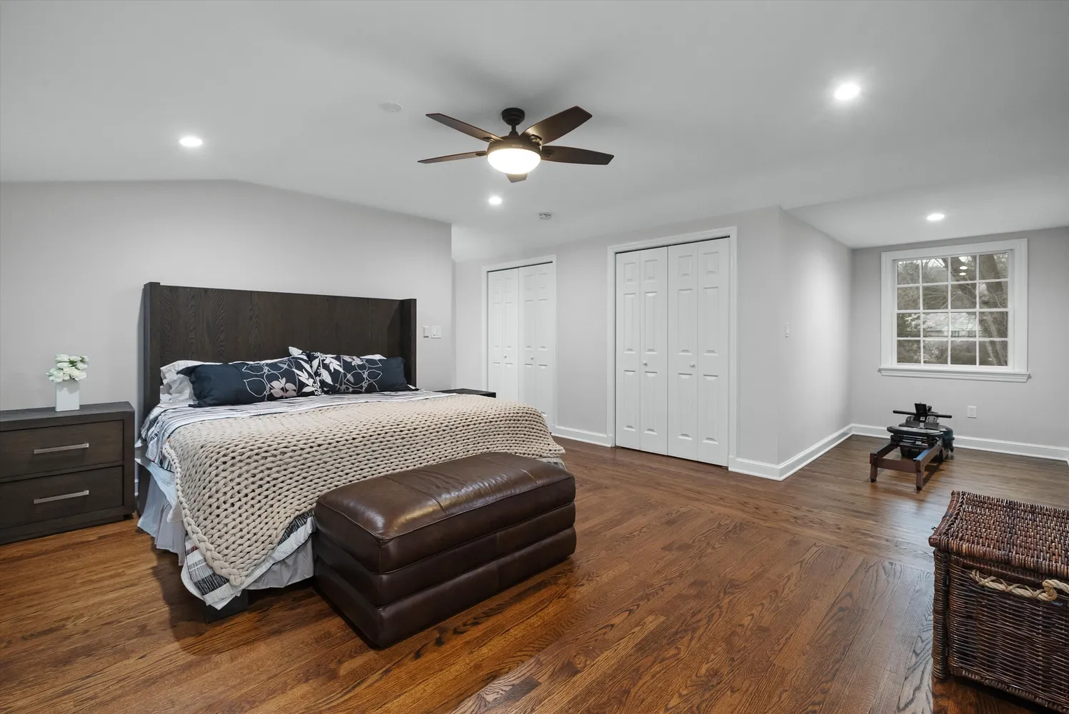 a bathroom with a double vanity sink toilet mirror and shower