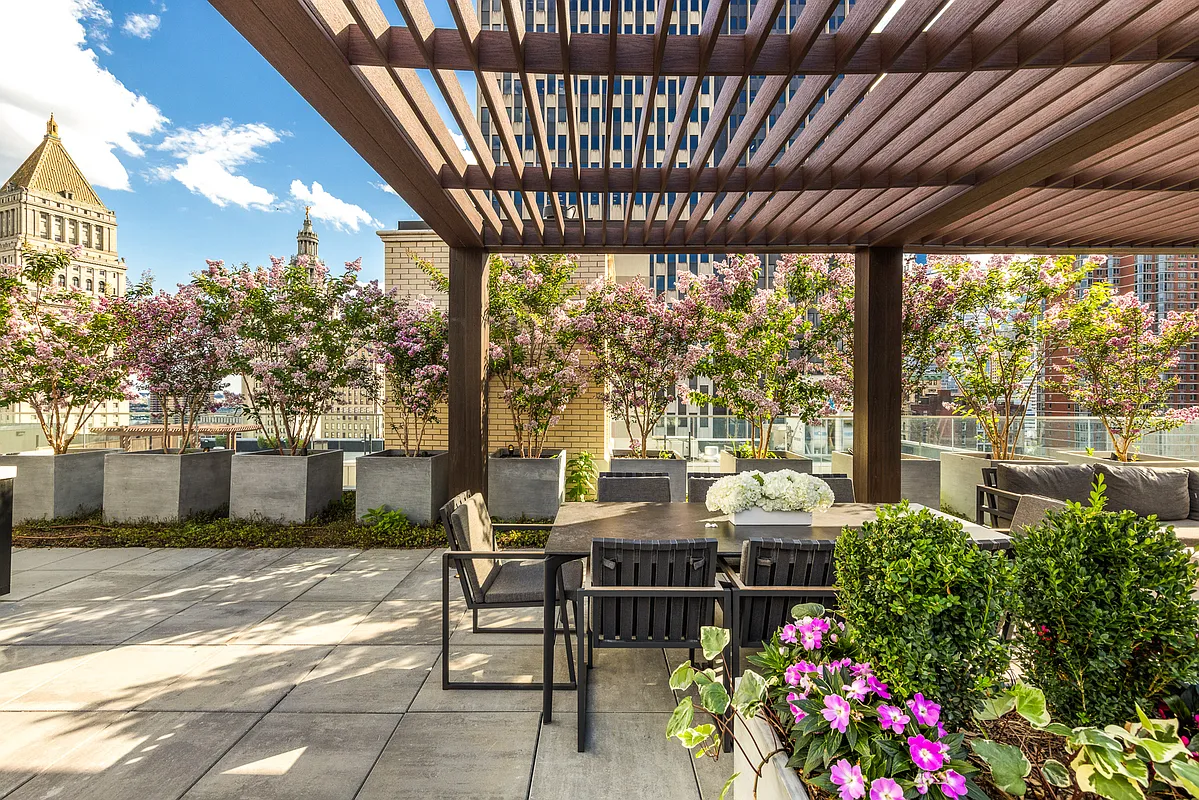 108 Leonard Street, Unit 5A Manhattan, NY 10013 - Photo 19 of 21 a view of a patio with table and chairs and potted plants