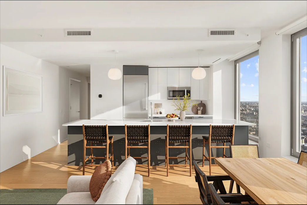 5 South 5th Street, Unit 5300 Brooklyn, NY 11249 - Photo 5 of 28 a view of a dining room with furniture window and wooden floor