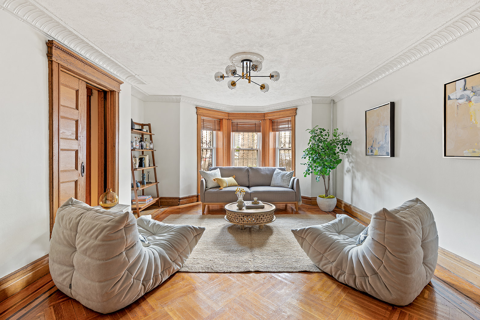 521 84th Street Brooklyn, NY 11209 - Photo 12 of 19 a living room with furniture flowerpot and a chandelier