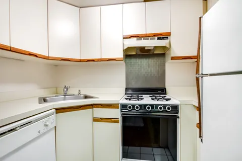 a kitchen with a stove and a microwave