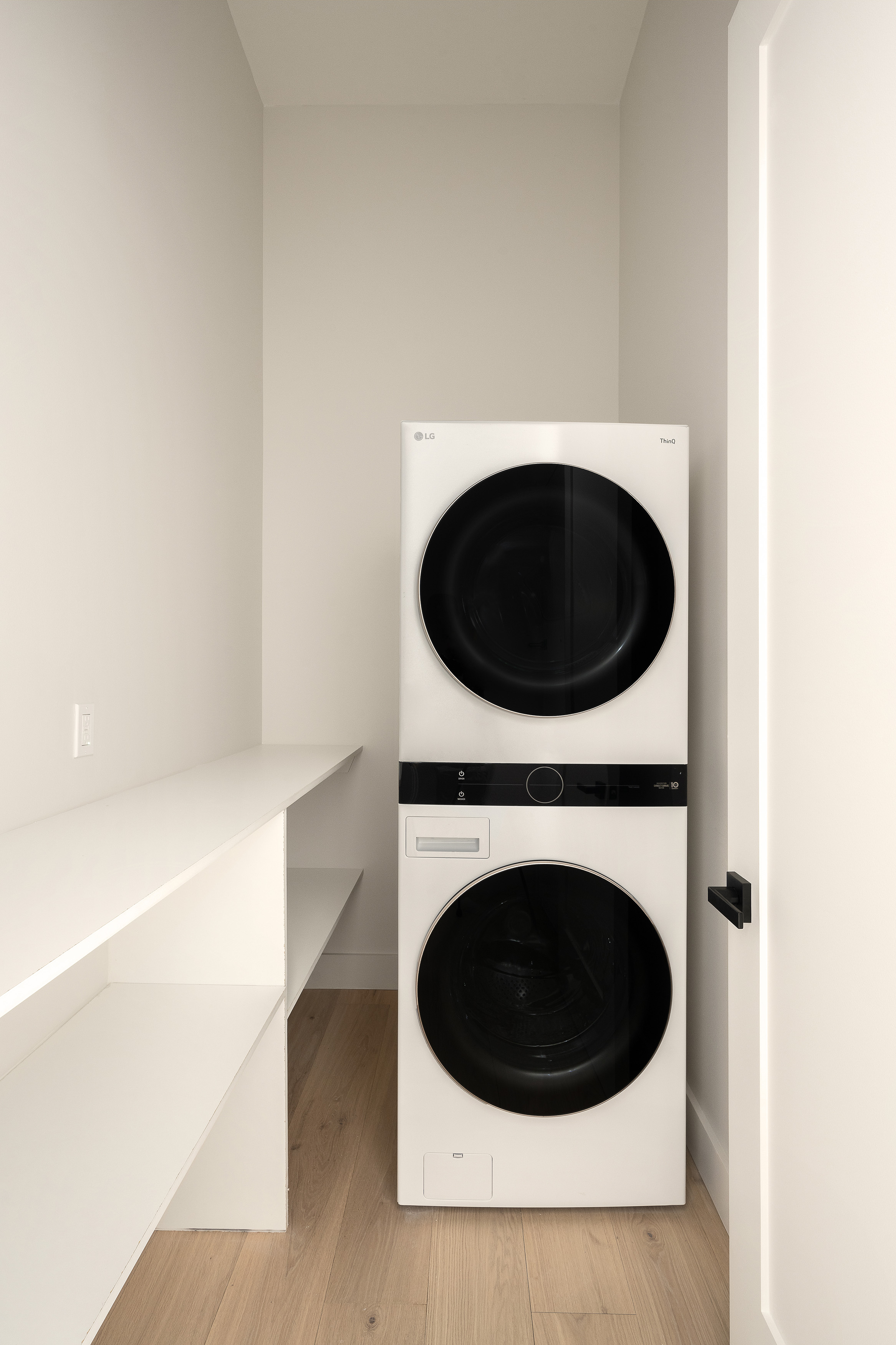 216 Grand Street, Unit LOFT 5 Brooklyn, NY 11211 - Photo 8 of 12 a utility room with dryer and washer