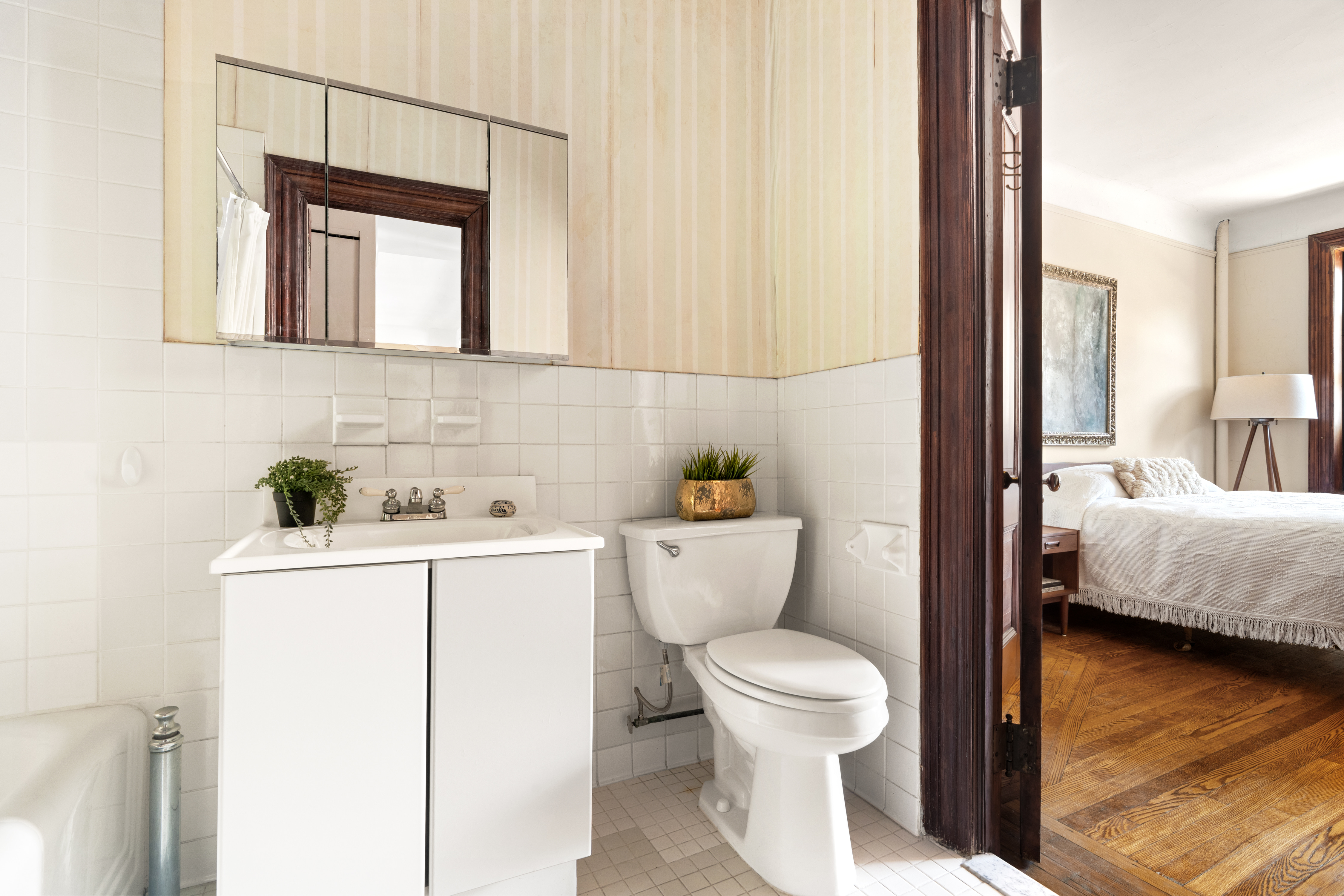 61 Pierrepont Street, Unit 24 Brooklyn, NY 11201 - Photo 8 of 11 a bathroom with a toilet a sink and mirror