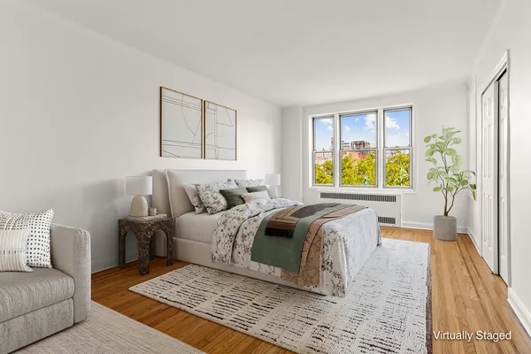a living room with a bed furniture and a couch