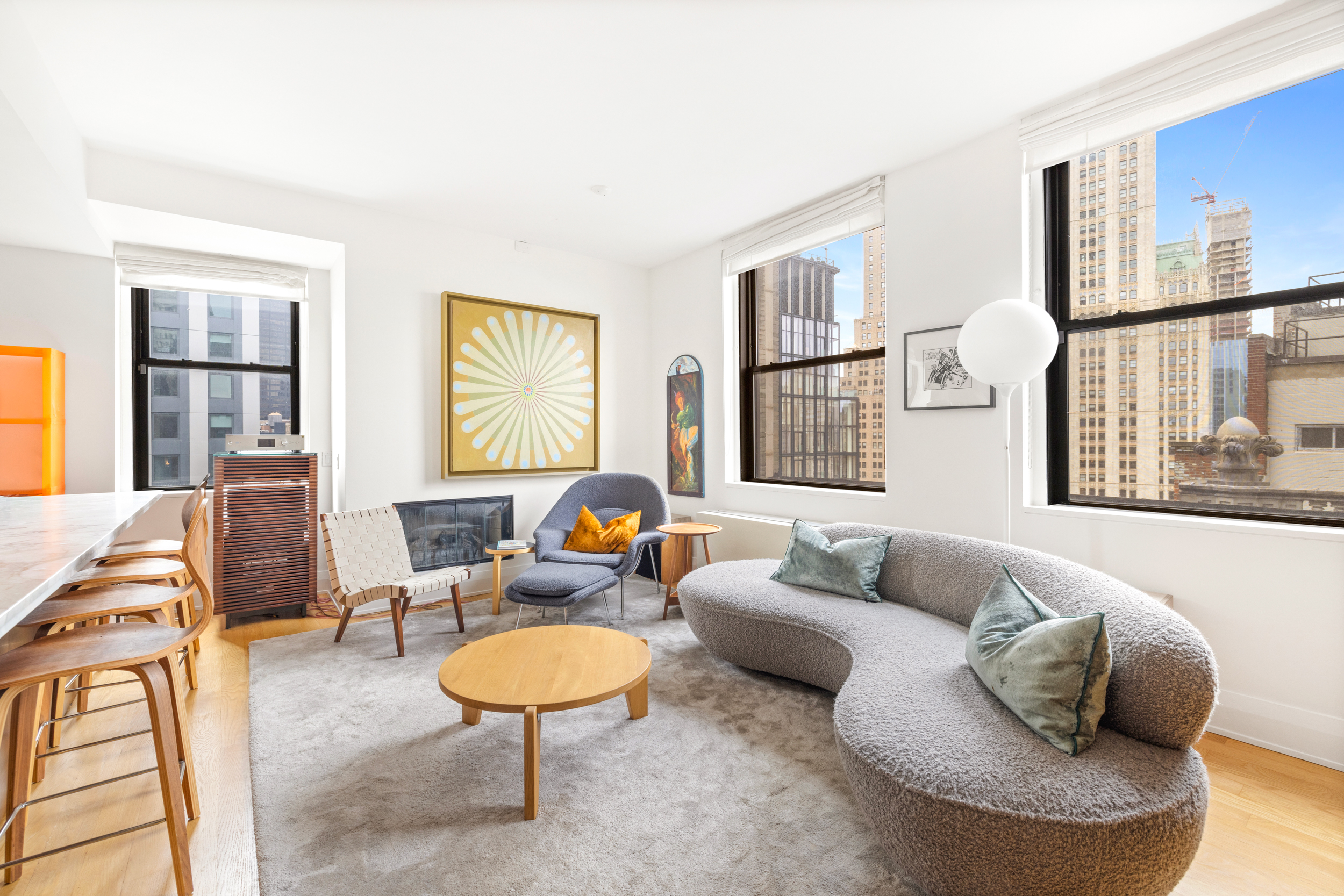 150 Nassau Street, Unit 19A Manhattan, NY 10038 - Photo 3 of 16 a living room with furniture and a large window