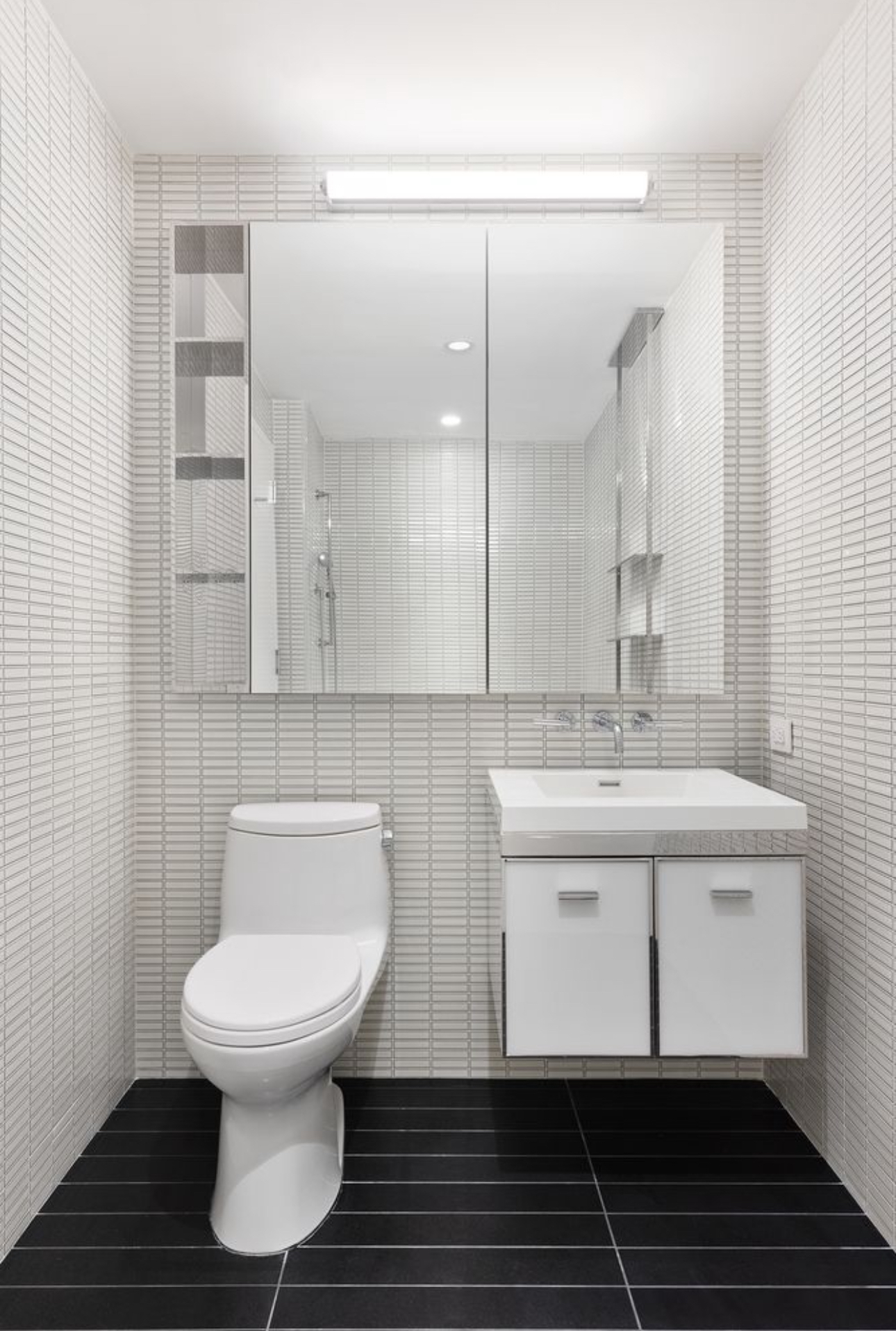 252 South Street, Unit 53B Manhattan, NY 10002 - Photo 13 of 24 a bathroom with a sink toilet and shower