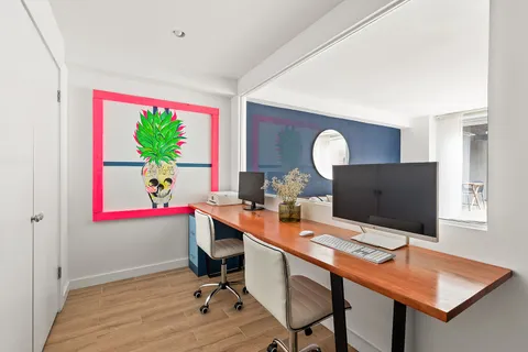 a view of a workspace with furniture