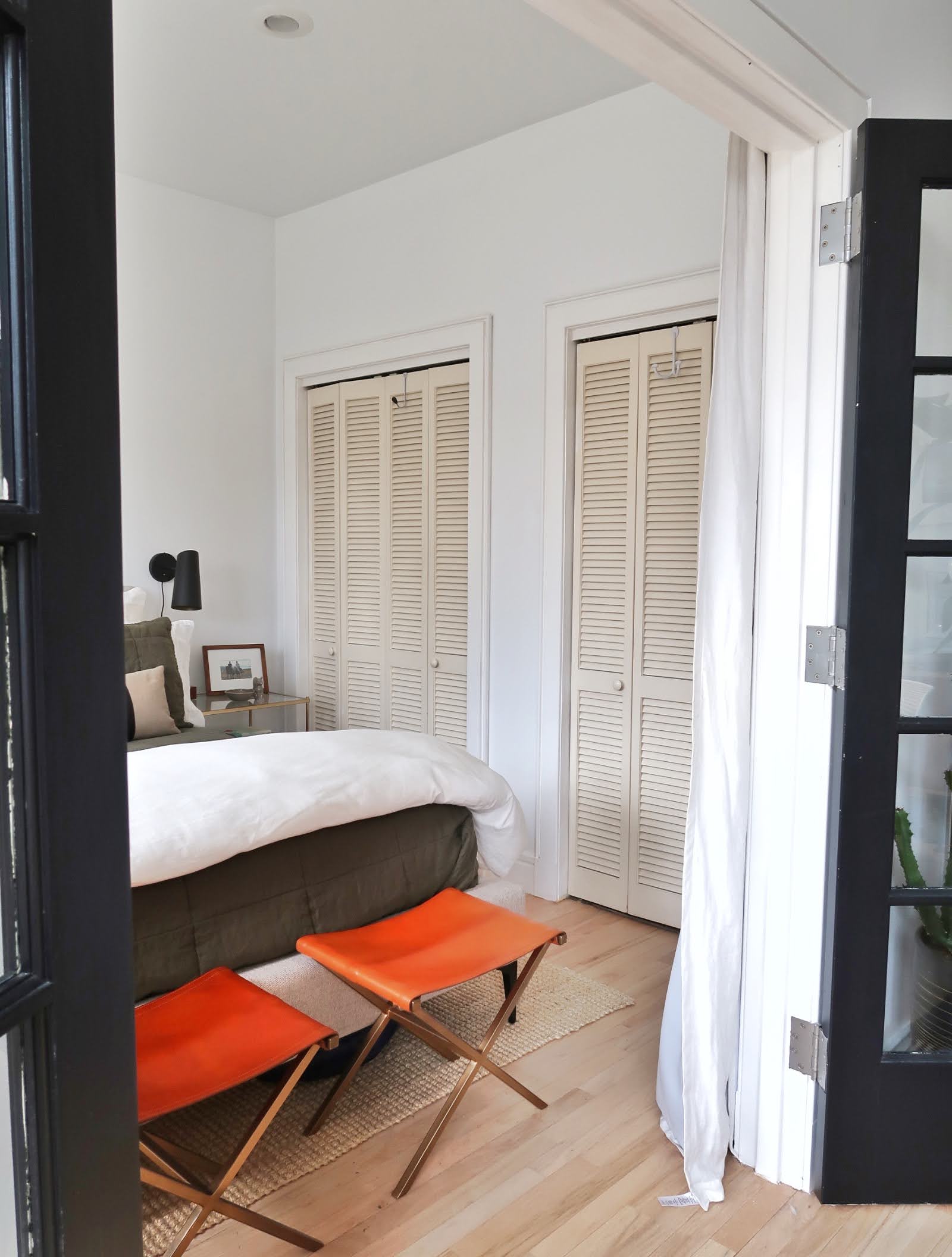 296 East 2nd Street, Unit 4G Manhattan, NY 10009 - Photo 13 of 14 a bedroom with a bed and wooden floor