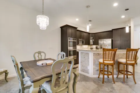 a view of a dining room with furniture