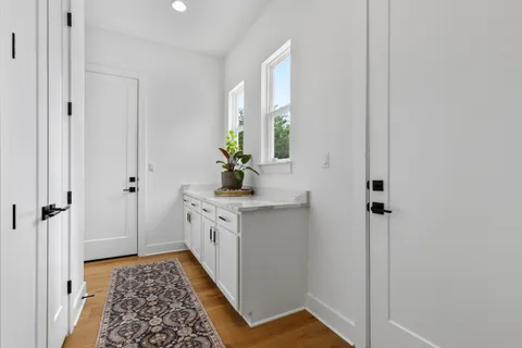 a utility room with sink dryer and washer