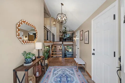 a view of entryway with wooden floor