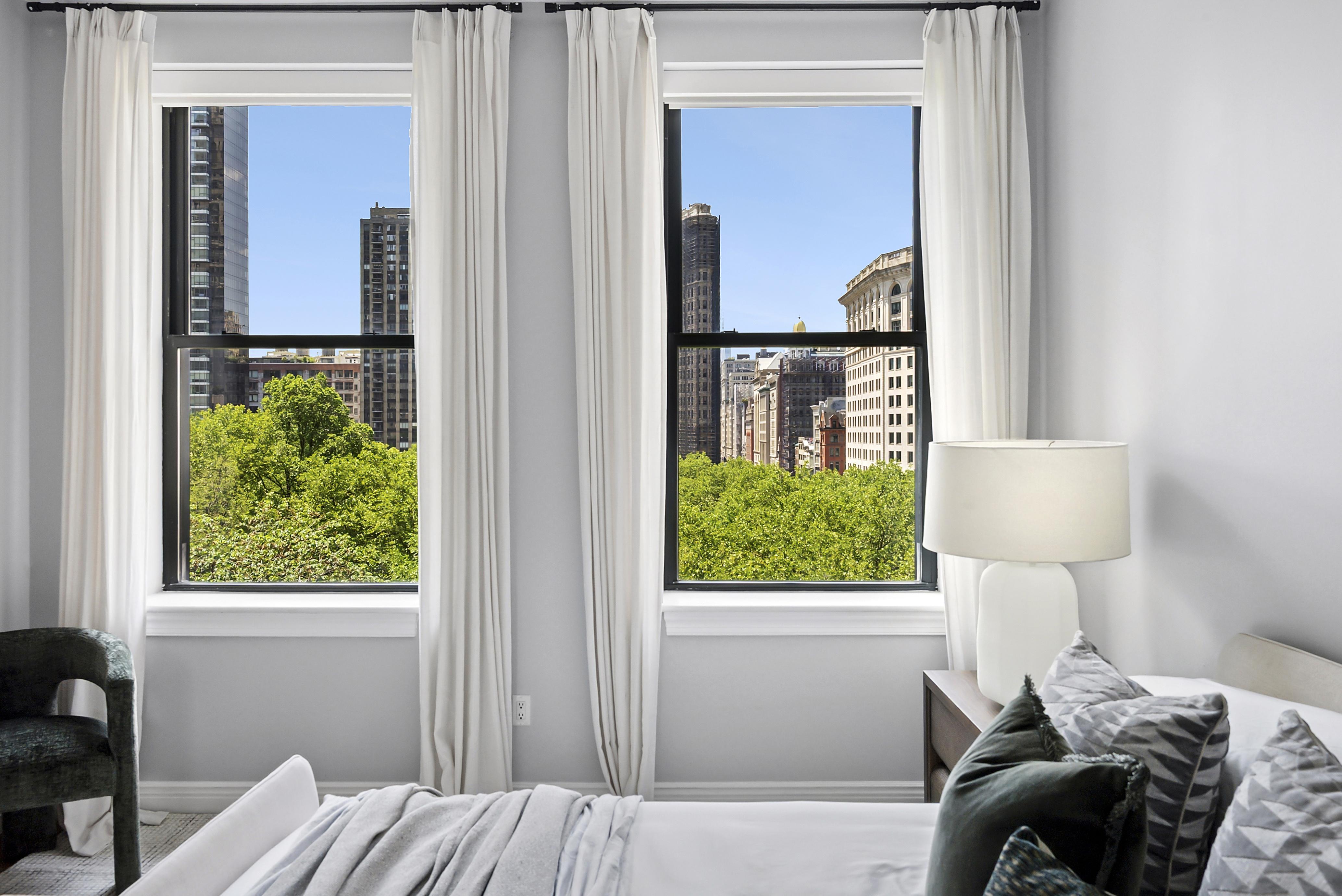 225 5th Avenue, Unit 7K Manhattan, NY 10010 - Photo 8 of 15 a bedroom with a bed and a window