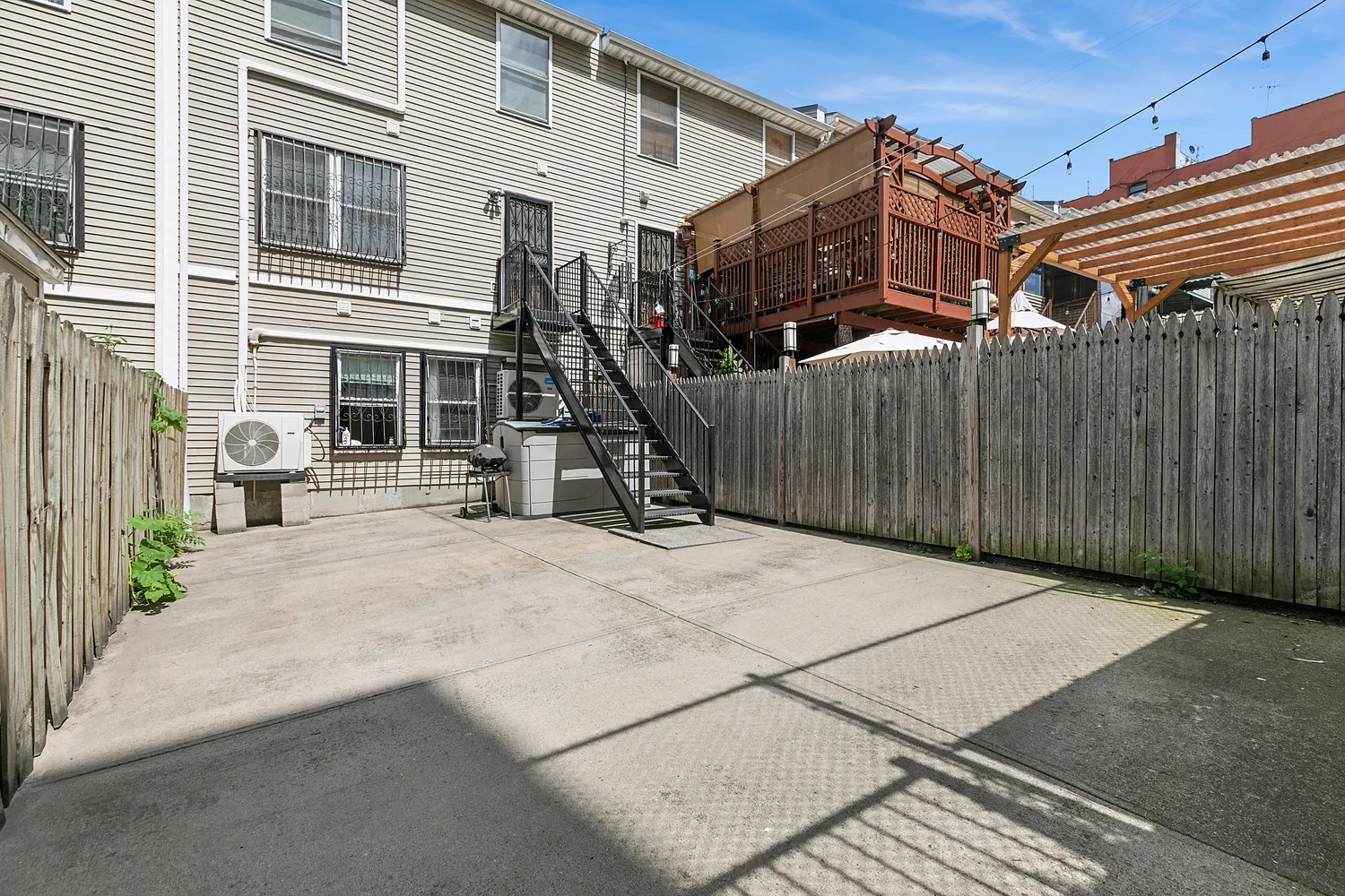 a view of a house with wooden fence