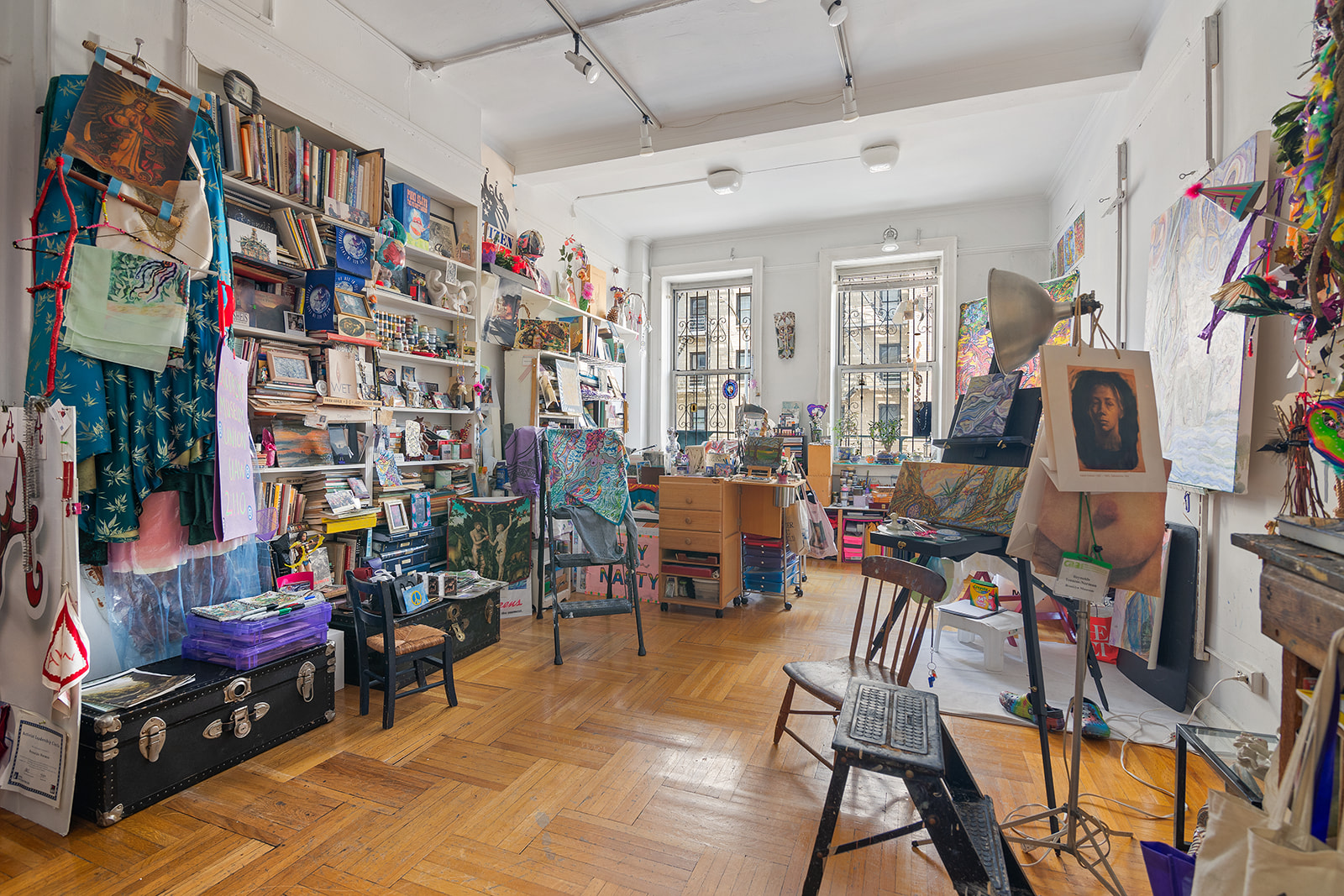41 Eastern Parkway, Unit 1D Brooklyn, NY 11238 - Photo 8 of 16 a living room filled with furniture and a book shelf