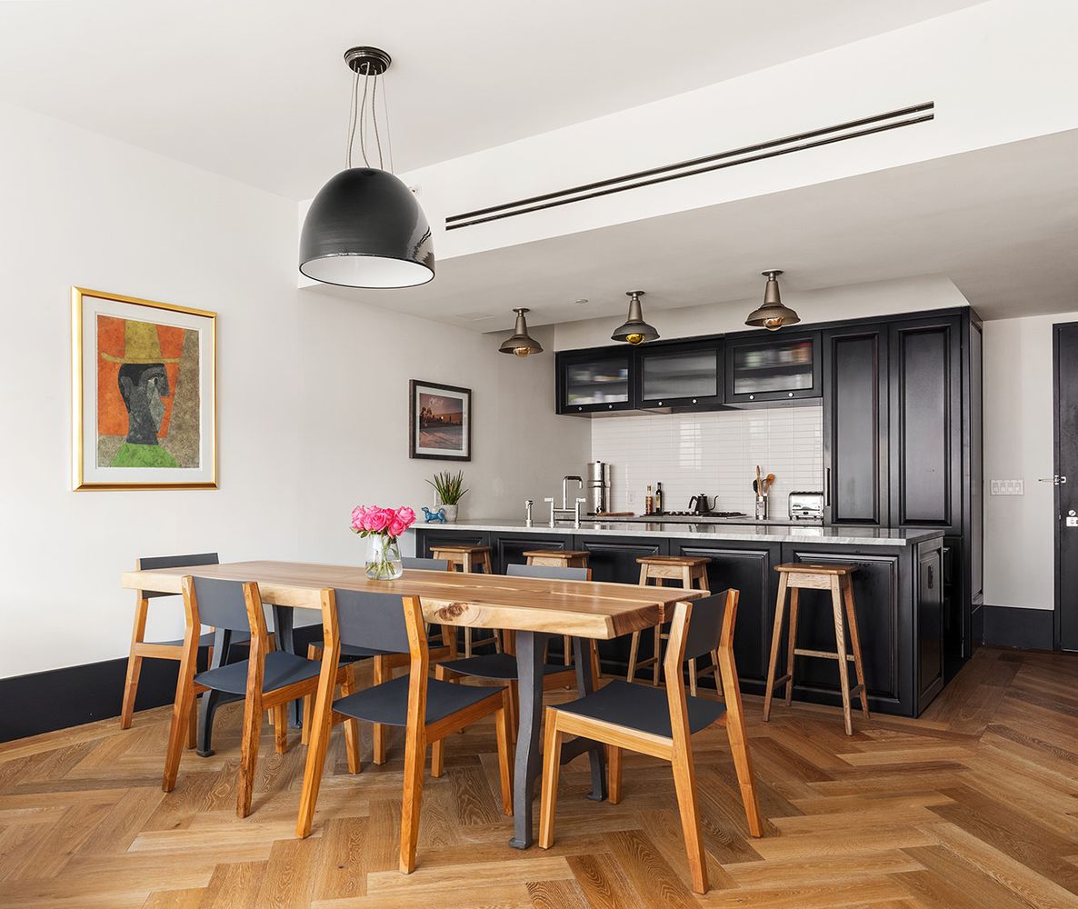 a view of a dining hall with furniture and window