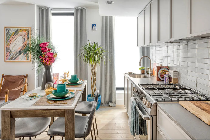 111 Montgomery Street, Unit 7C Brooklyn, NY 11225 - Photo 7 of 11 a kitchen with a stove a refrigerator and cabinets