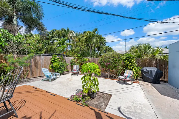 a view of a backyard with sitting area