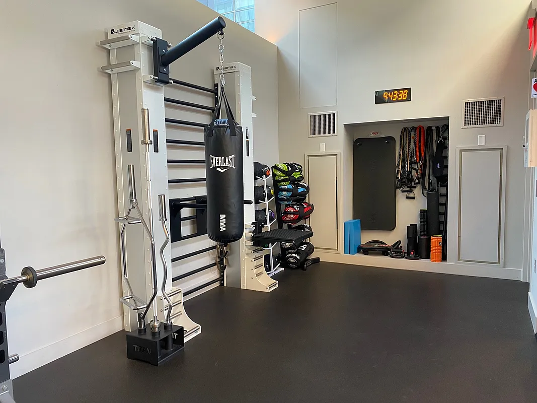 101 Warren Street, Unit 840 Manhattan, NY 10007 - Photo 9 of 16 a view of a room with gym equipment