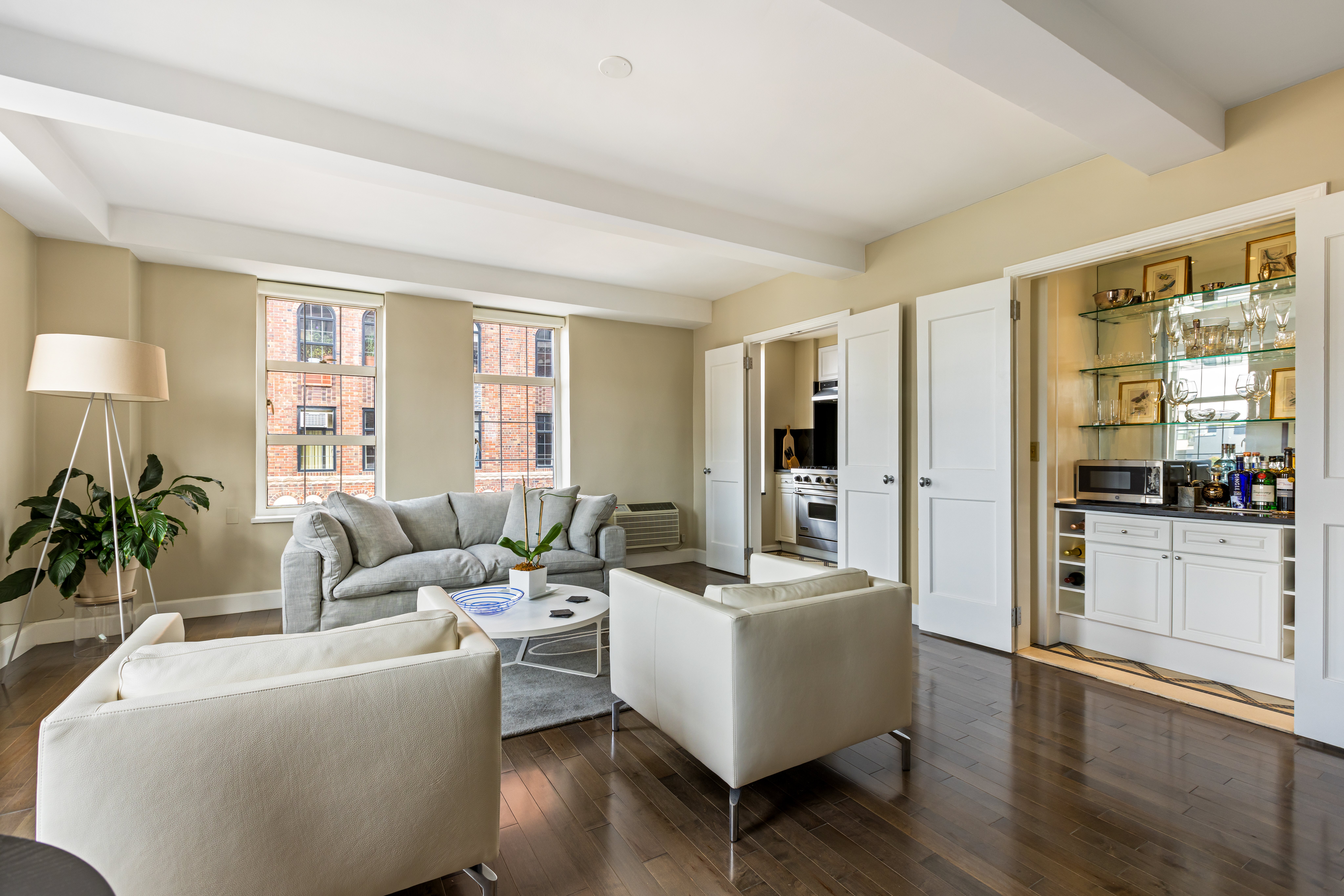 465 West 23rd Street, Unit 15B Manhattan, NY 10011 - Photo 2 of 19 a living room with furniture and a large window