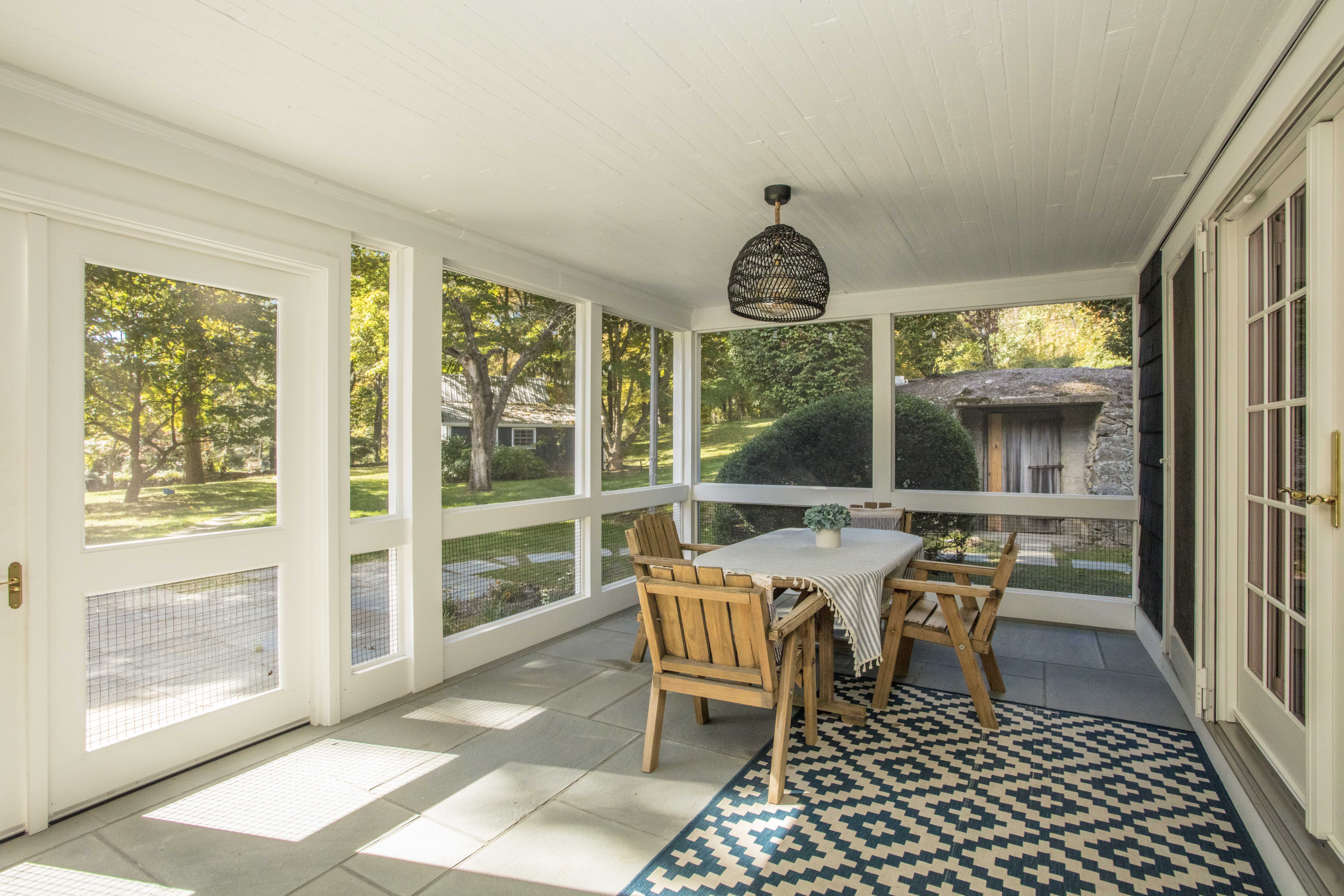 41 Harris Road Katonah, NY 10536 - Photo 35 of 48 a dining room with furniture a chandelier and wooden floor