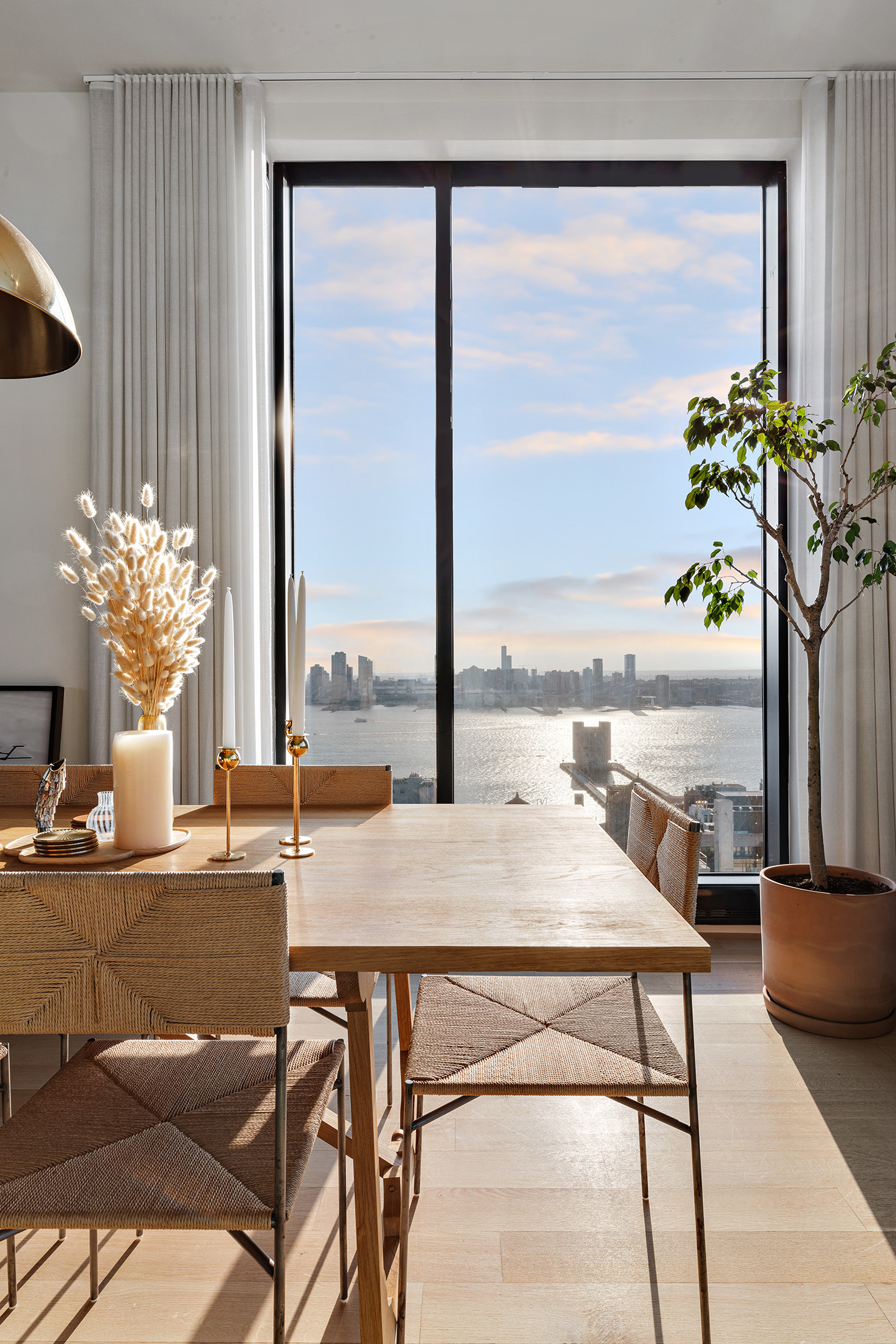 570 Broome Street, Unit PHA Manhattan, NY 10013 - Photo 4 of 22 a view of a dining room with furniture and a potted plant