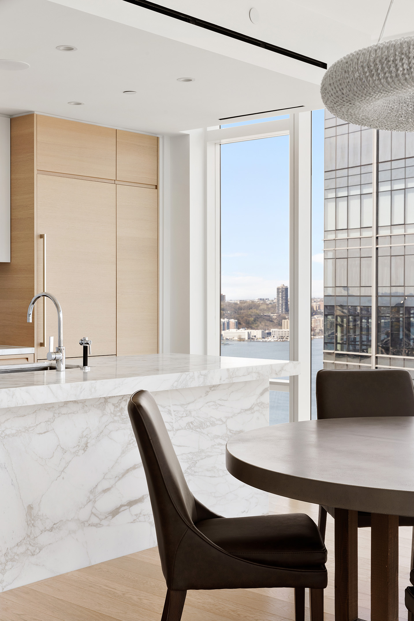30 Riverside Boulevard, Unit 33D Manhattan, NY 10069 - Photo 3 of 18 a view of a dining room with a table and chairs