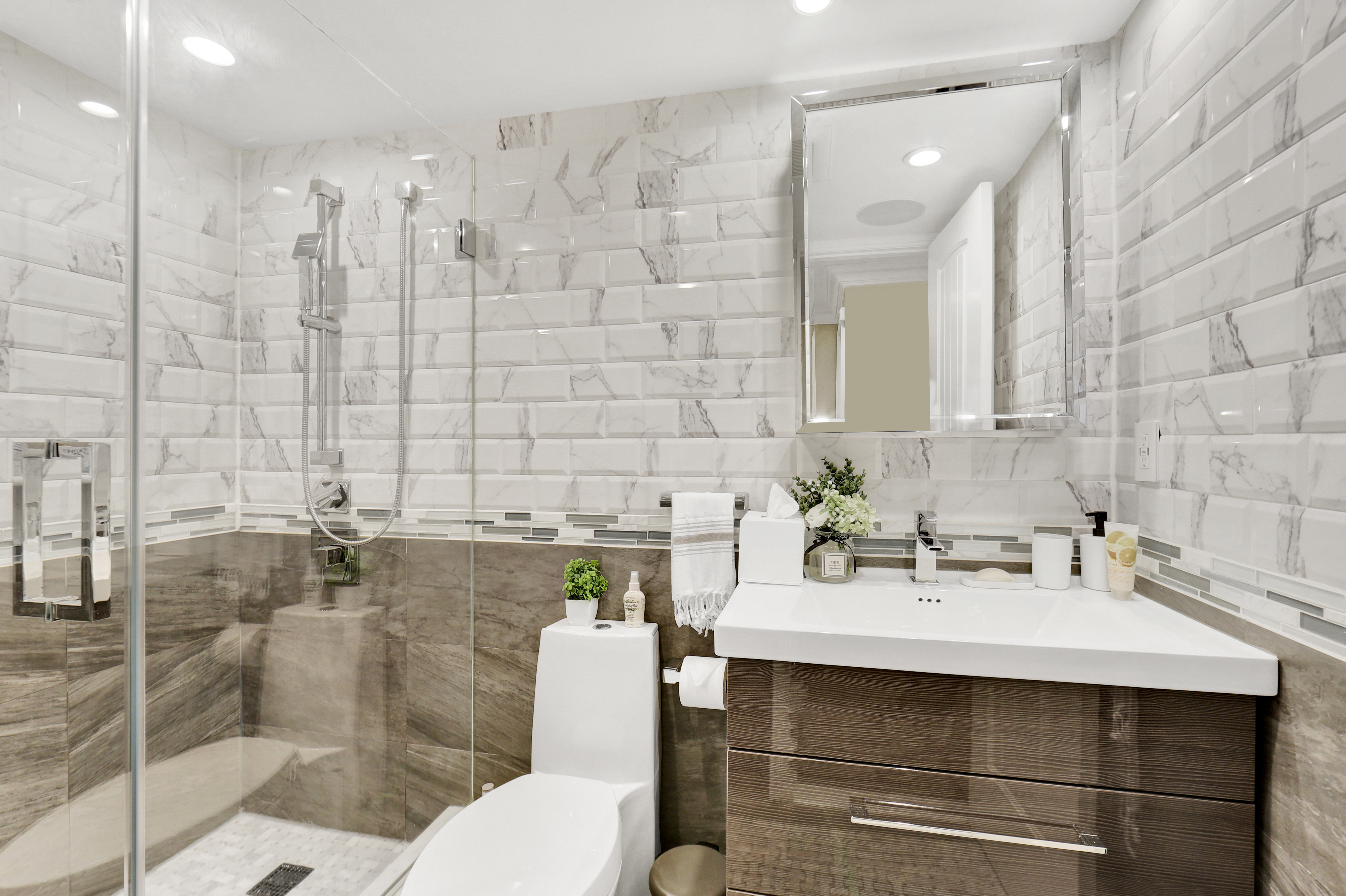 1-69 Beach 98th Street, Unit 1 Queens, NY 11694 - Photo 11 of 23 a bathroom with a sink and a mirror