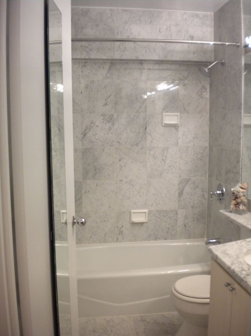 45 East 25th Street, Unit 12E Manhattan, NY 10010 - Photo 3 of 5 a bathroom with a shower and a toilet