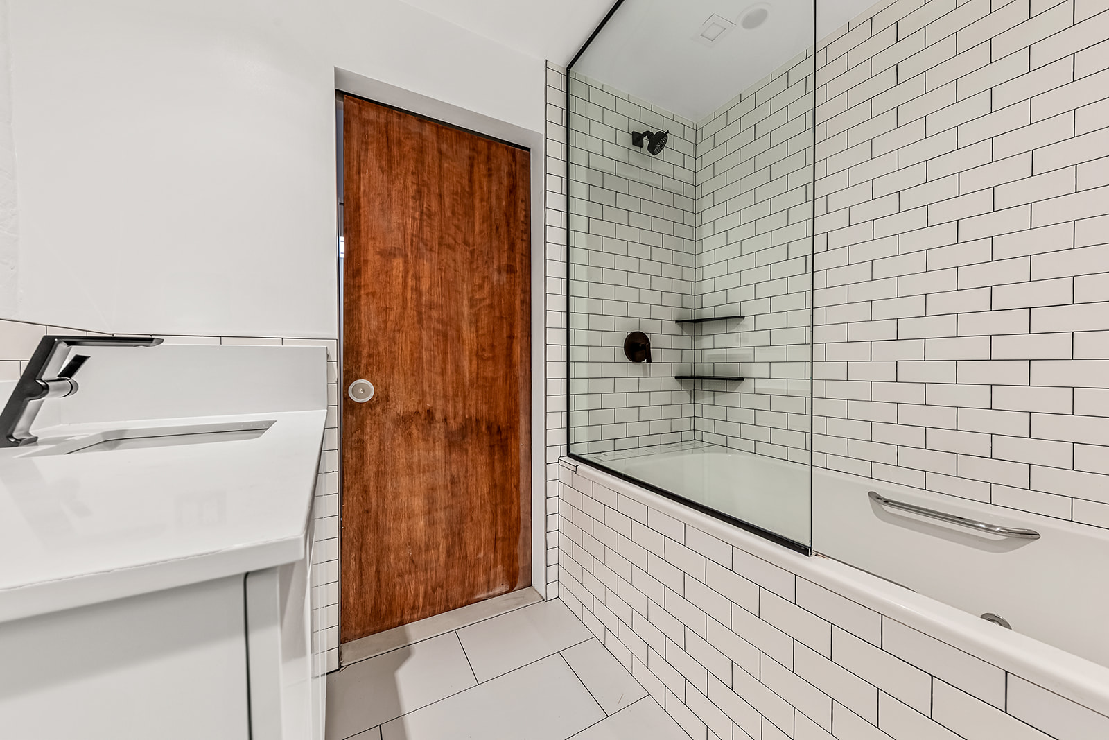 130 Watts Street, Unit 5N Manhattan, NY 10013 - Photo 10 of 11 a bathroom with a shower