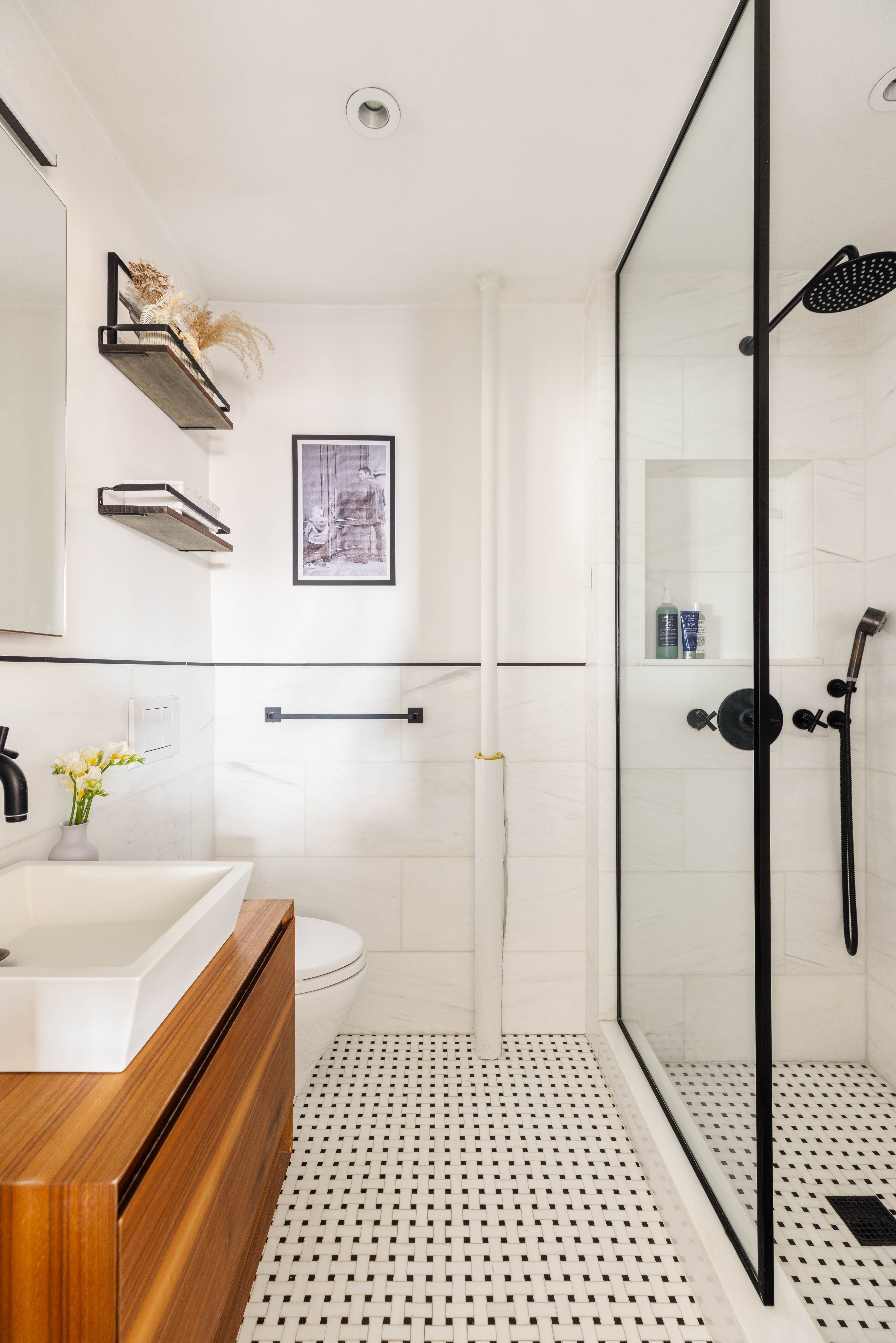 200 East 16th Street, Unit 14C Manhattan, NY 10003 - Photo 9 of 14 a bathroom with a sink a toilet and shower