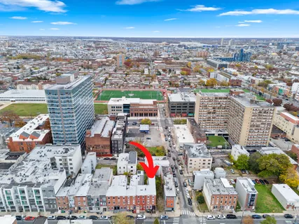 an aerial view of residential building and parking space