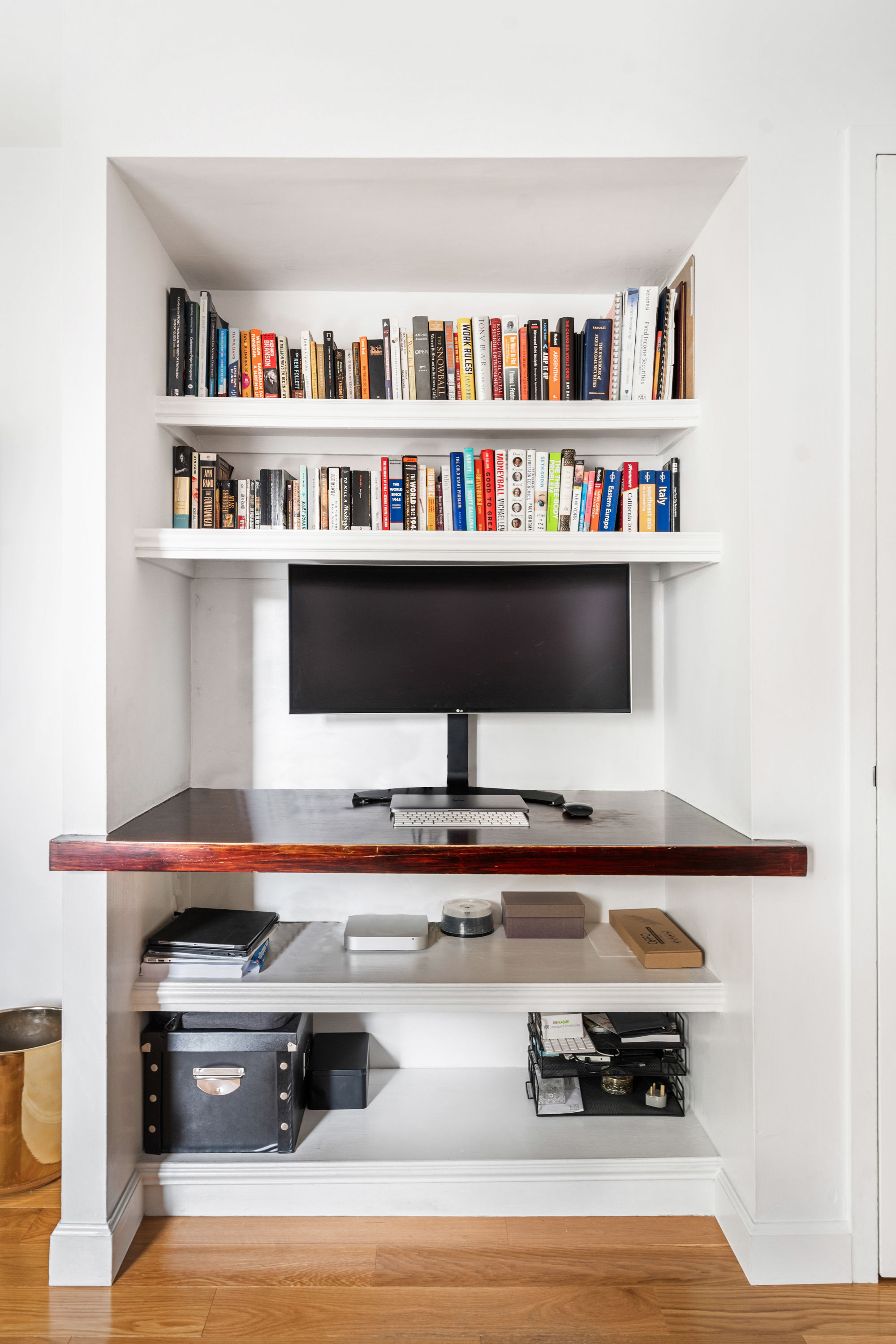 164 Bank Street, Unit 5B Manhattan, NY 10014 - Photo 3 of 11 a living room with furniture and a book shelf
